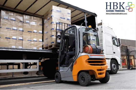 HBK Global Trading delivery van unloading high-tech cargo from Taiwan at a Philippine SME facility.